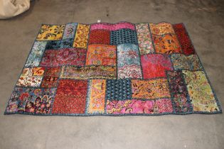 An approx. 7'8" x 5'4" wool floral patterned rug