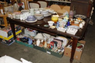 An Edwardian extending dining table with winding h