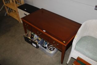 A reproduction yew wood coffee table