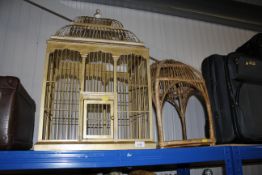 A gilded wooden bird cage with removable top and a