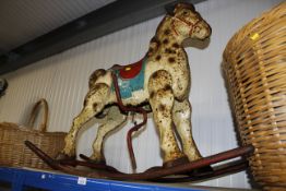 A vintage tin rocking horse