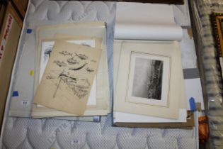 A collection of various unframed pictures and prin