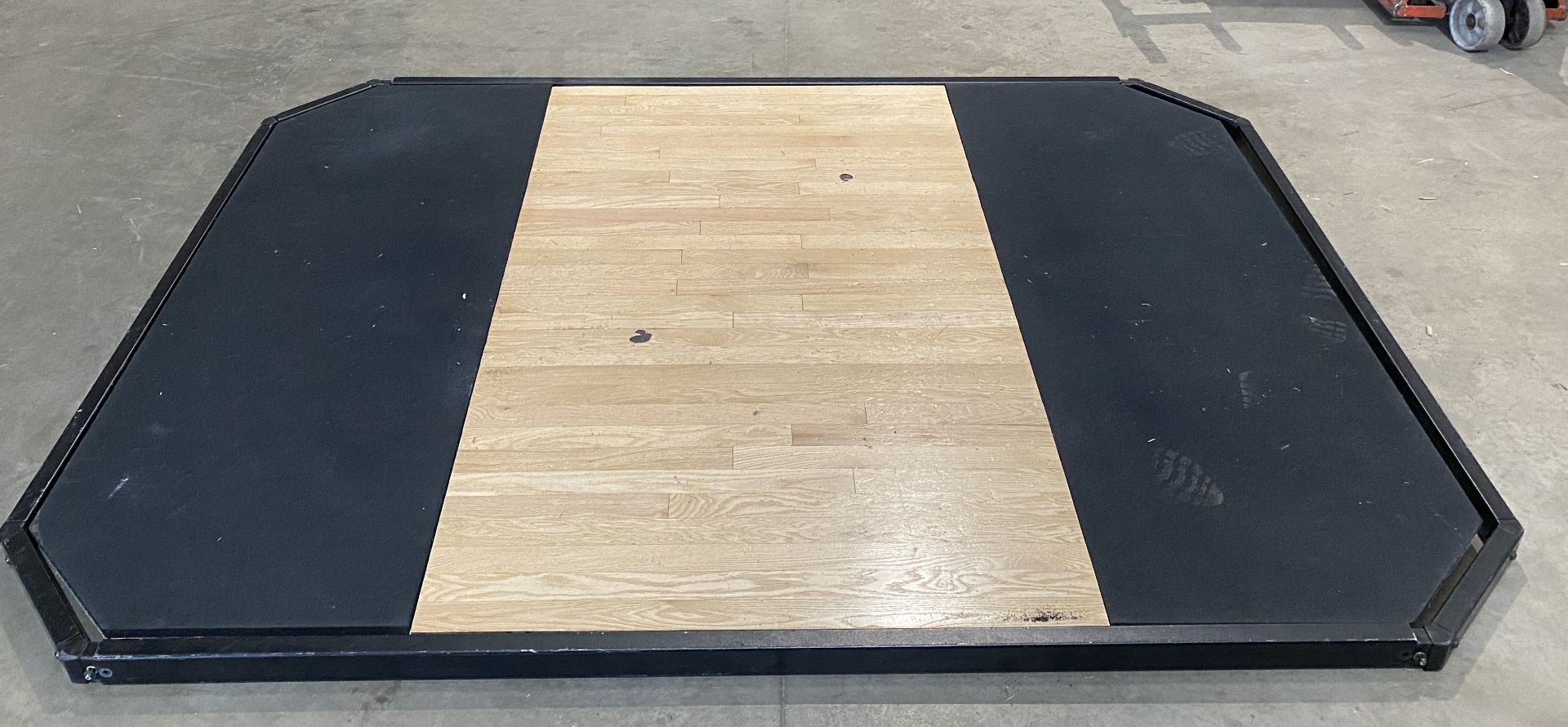 A wood and rubber made octagonal gym floor - approximately 257cm x 192cm