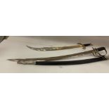 Two reproduction swords - Cimitarra Scimitar 73cm long and a cavalryman's sword, 90cm long,