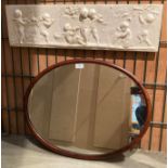 Plaster relief 'Puttii Playing' 12cm x 74cm and a mahogany oval framed wall mirror 50cm x 60cm (2)
