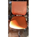 An orange mesh seat and back operators swivel armchair (saleroom location: main area)