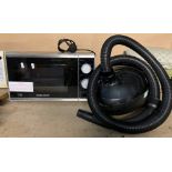 A Morphy Richards microwave and a Daewoo 1500 vacuum cleaner (2) (saleroom location: PO)