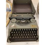 A Hermes Baby portable typewriter in case (saleroom location: H08)