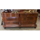 A figured walnut shaped front serving table with two frieze drawers over four drawers,
