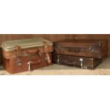 Two brown leather suitcases, one with initials J.