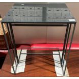 Grey metal framed hall table with a metallic grey coloured glass top,