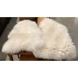 Two genuine sheep skin rugs approximately 100cm x 65cm each (saleroom location: kit area)