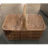 A large wicker picnic hamper with handle 60cm x 40cm x 30cm deep (saleroom location: PO)