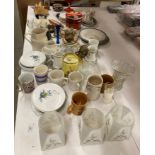 Contents to shelf - a quantity of assorted crockery and glassware, three 1950's light shades,