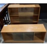 Two light oak bookcases with glass sliding doors - one with three shelves (90cm x 84cm x 23cm) and