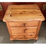 A pine three drawer bedside chest of drawers (Saleroom location S3)