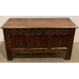 An 18th century oak coffer carved with inlay decoration 120cm x 49cm x 65cm (old crack to top and