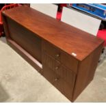 Mahogany finish wall unit comprising three drawers and fall front bureau section with writing slope,