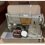 Singer electric foot operated sewing machine 328K with carrying case (saleroom location: kit area)