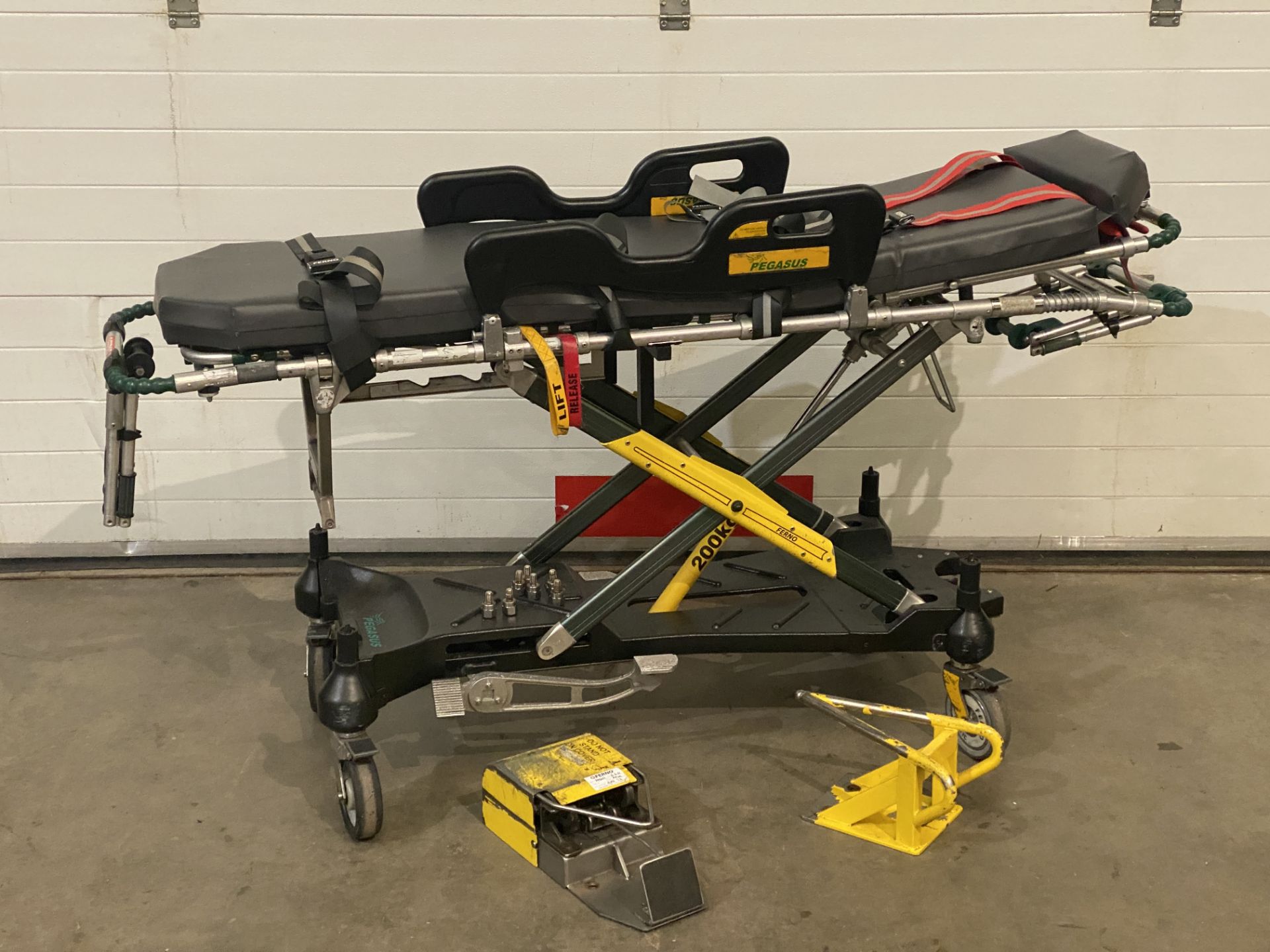 A Ferno Care Pegasus ambulance trolley with standard 2 part Trolley Lock and bolts