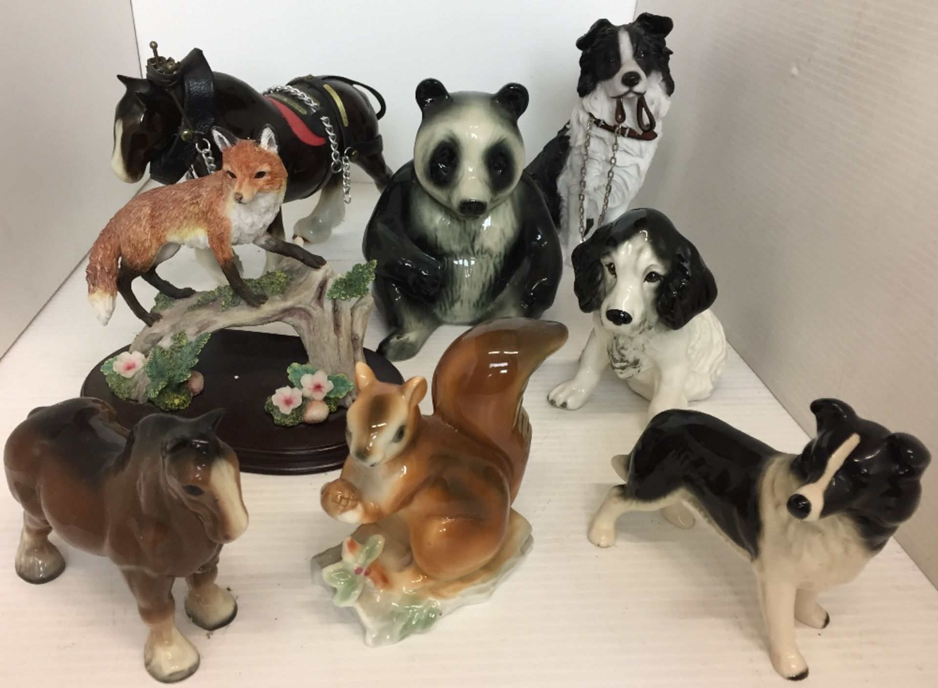 Eight items including a seated Leonardo Collection Border Collie 17cm high,