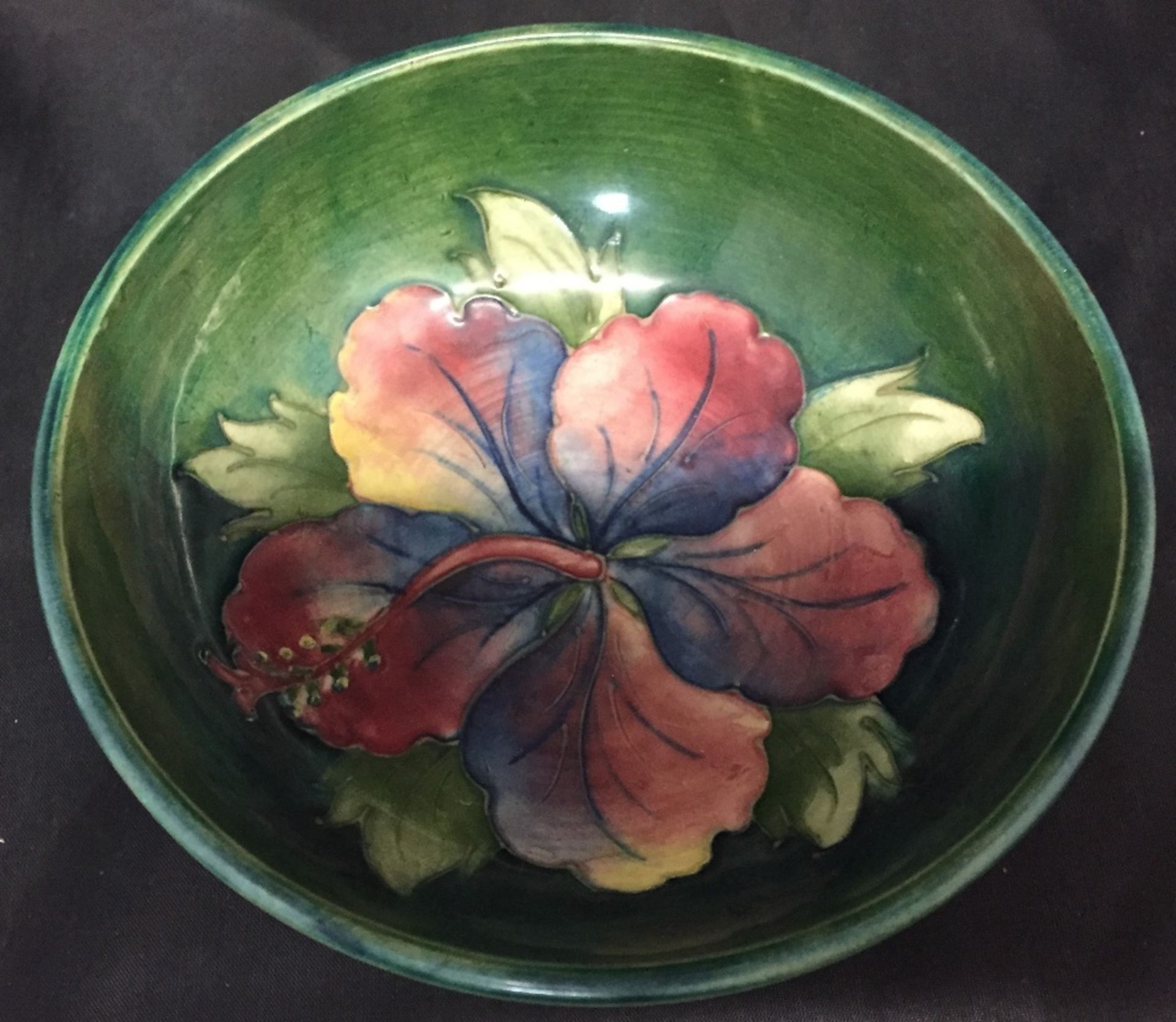 A Moorcroft green glazed Hibiscus pattern dish 14cm diameter (saleroom location: V12) - Image 2 of 4