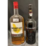 A one litre bottle of Eclipse Mount Gay Barbados Rum 40% volume and a 75cl bottle of Cockburn's