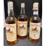 Three one litre bottles of The Famous Grouse Finest Scotch Whisky,