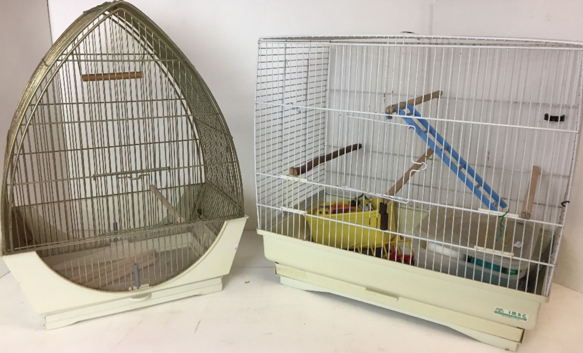 Two bird cages - one 51 x 29 x 48cm high and the other 40 max x 25 x 52cm high and bird cage
