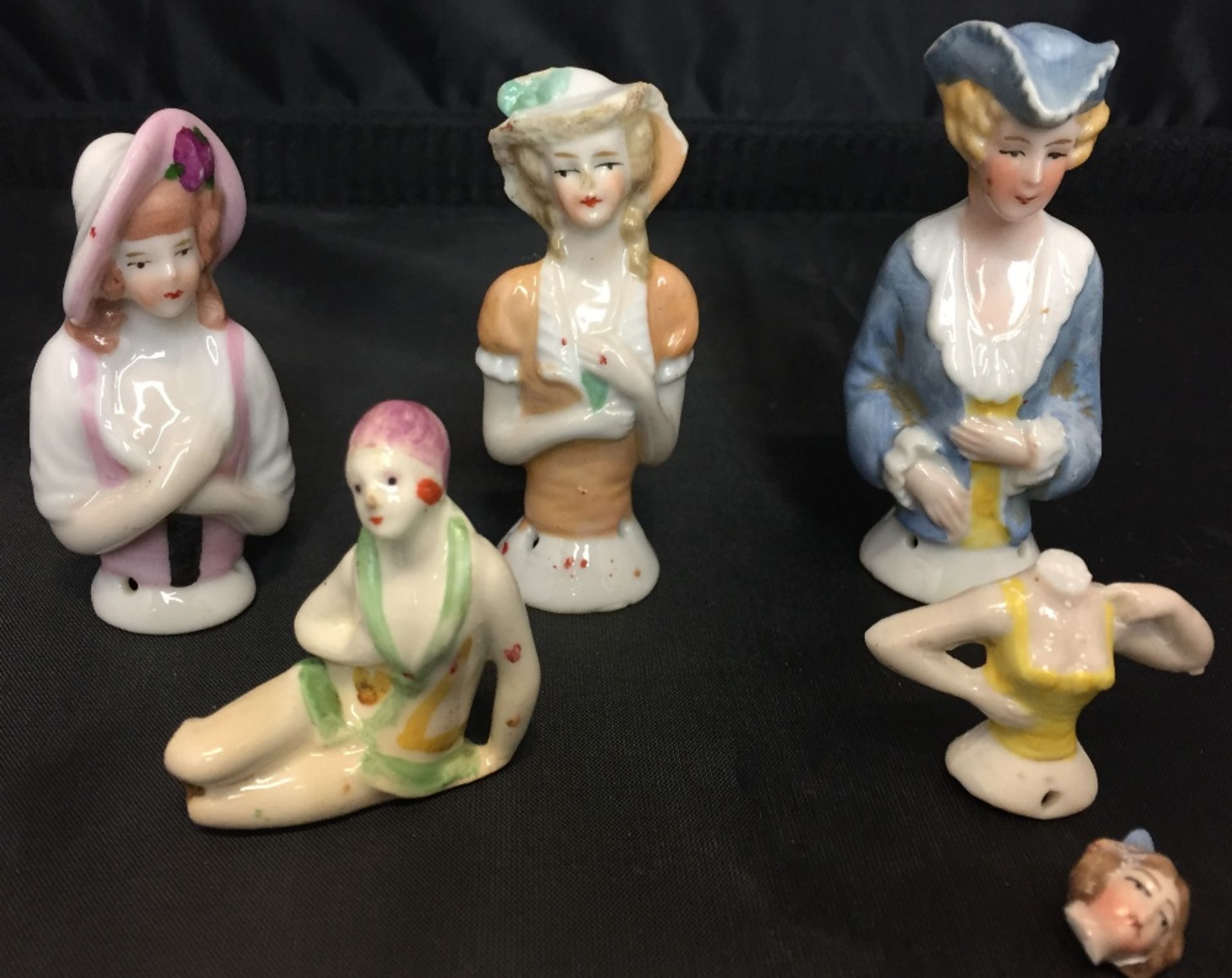 Five items including four vintage half doll pin cushions (tallest 7.
