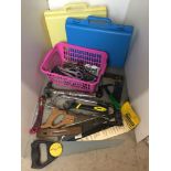 Pink plastic box containing tools including saws,