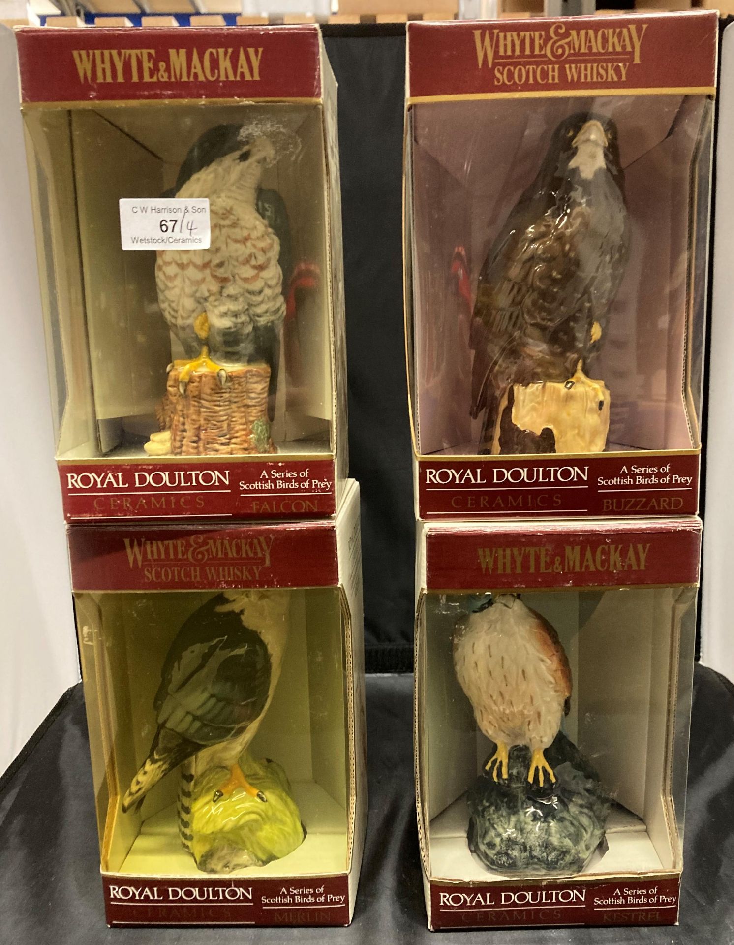 Four Royal Doulton boxed Scottish birds of prey series ceramic decanters each filled with Whyte &