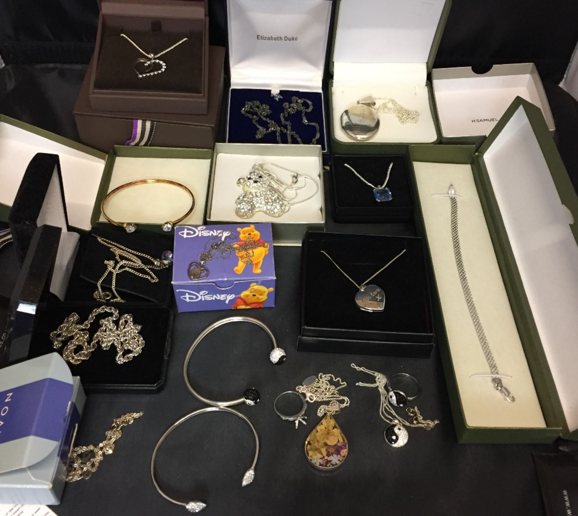 Sixteen sterling silver items - necklaces, lockets, pendants, bangles,