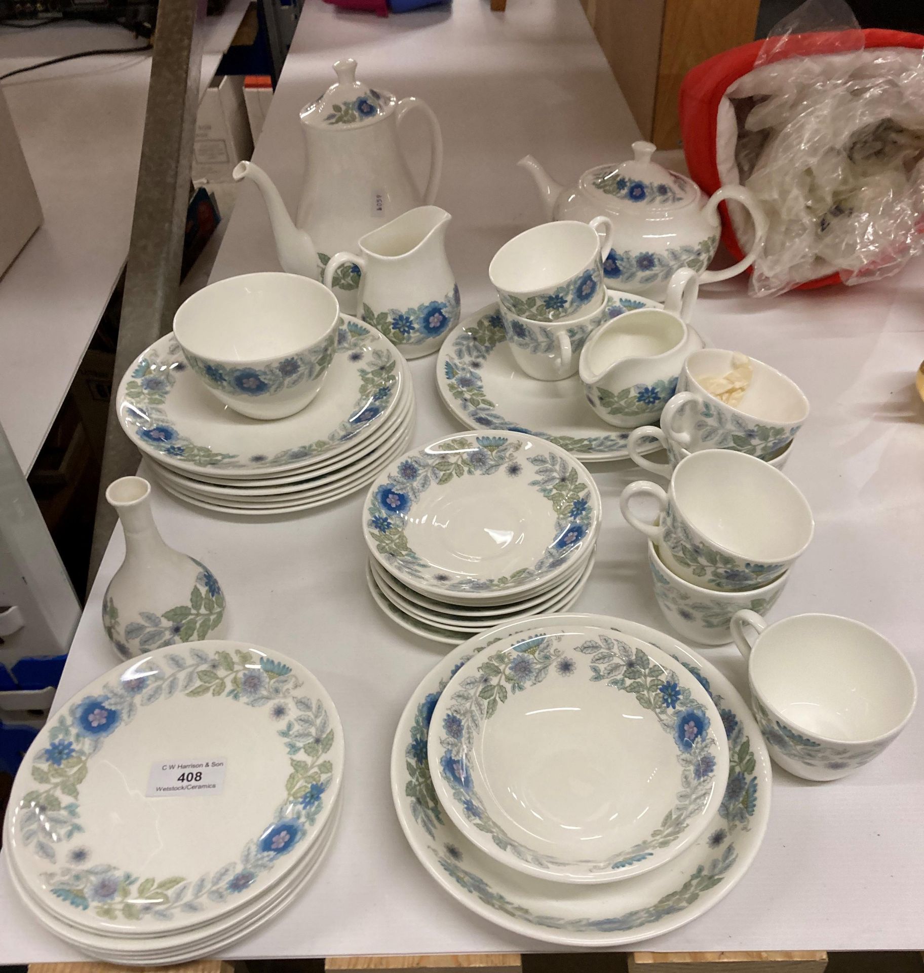 Thirty-Seven Pieces of Wedgewood Clementine tableware including tea and coffee pot, plates, cups,