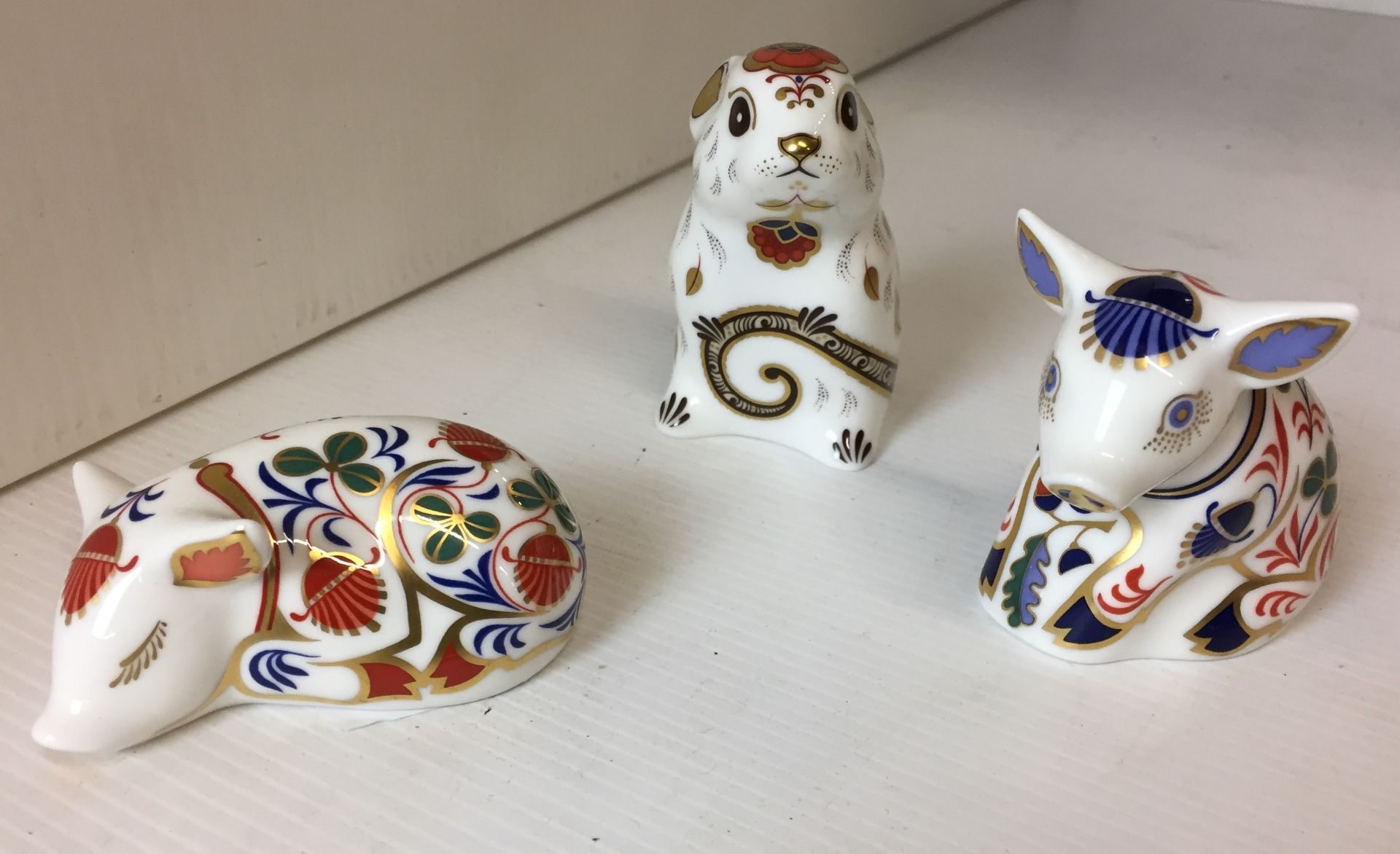 Three Royal Crown Derby figures - mouse 8cm and two pigs (saleroom location: N03)