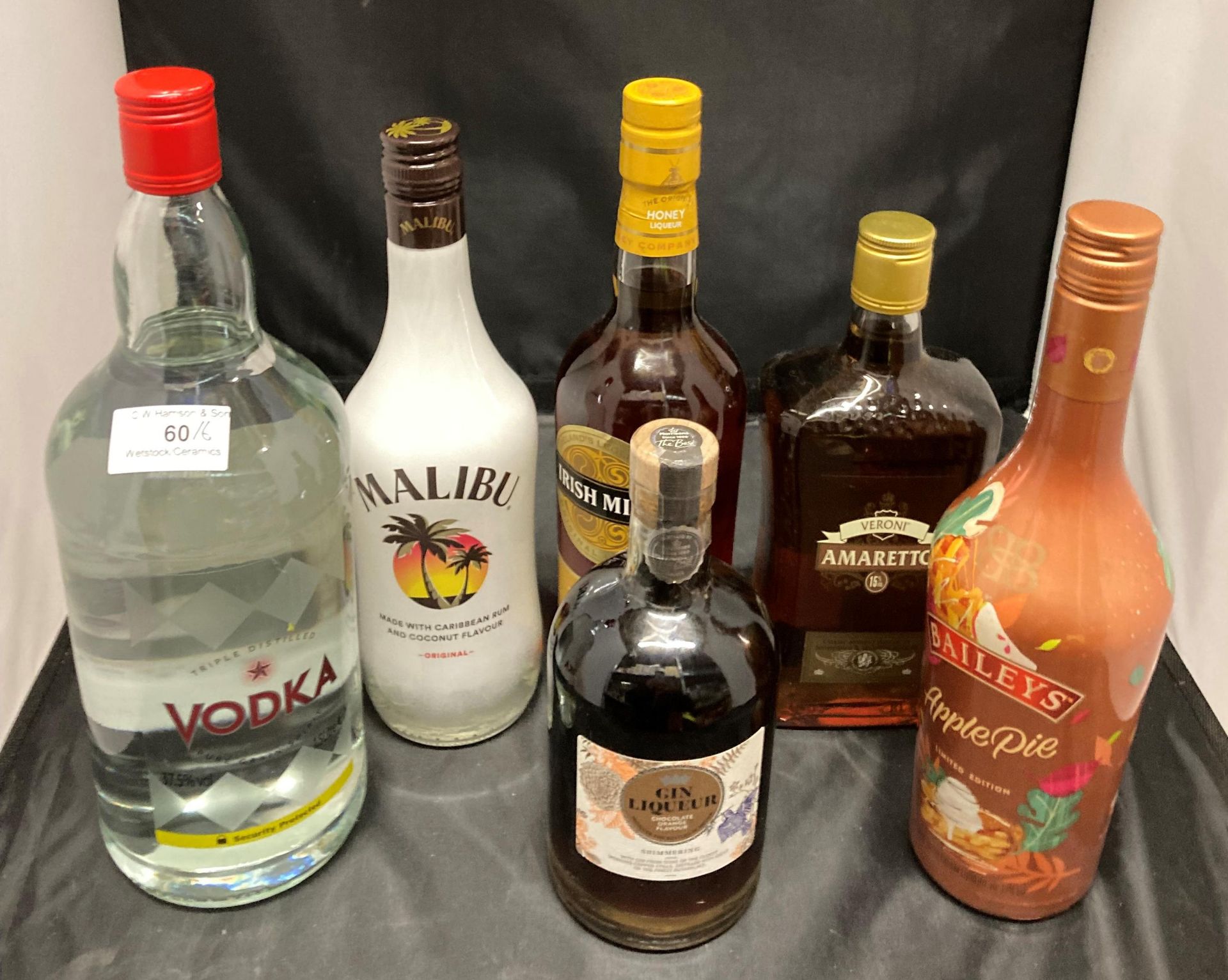 Six various bottles of spirits and liqueurs including 1.5 litre vodka 37.