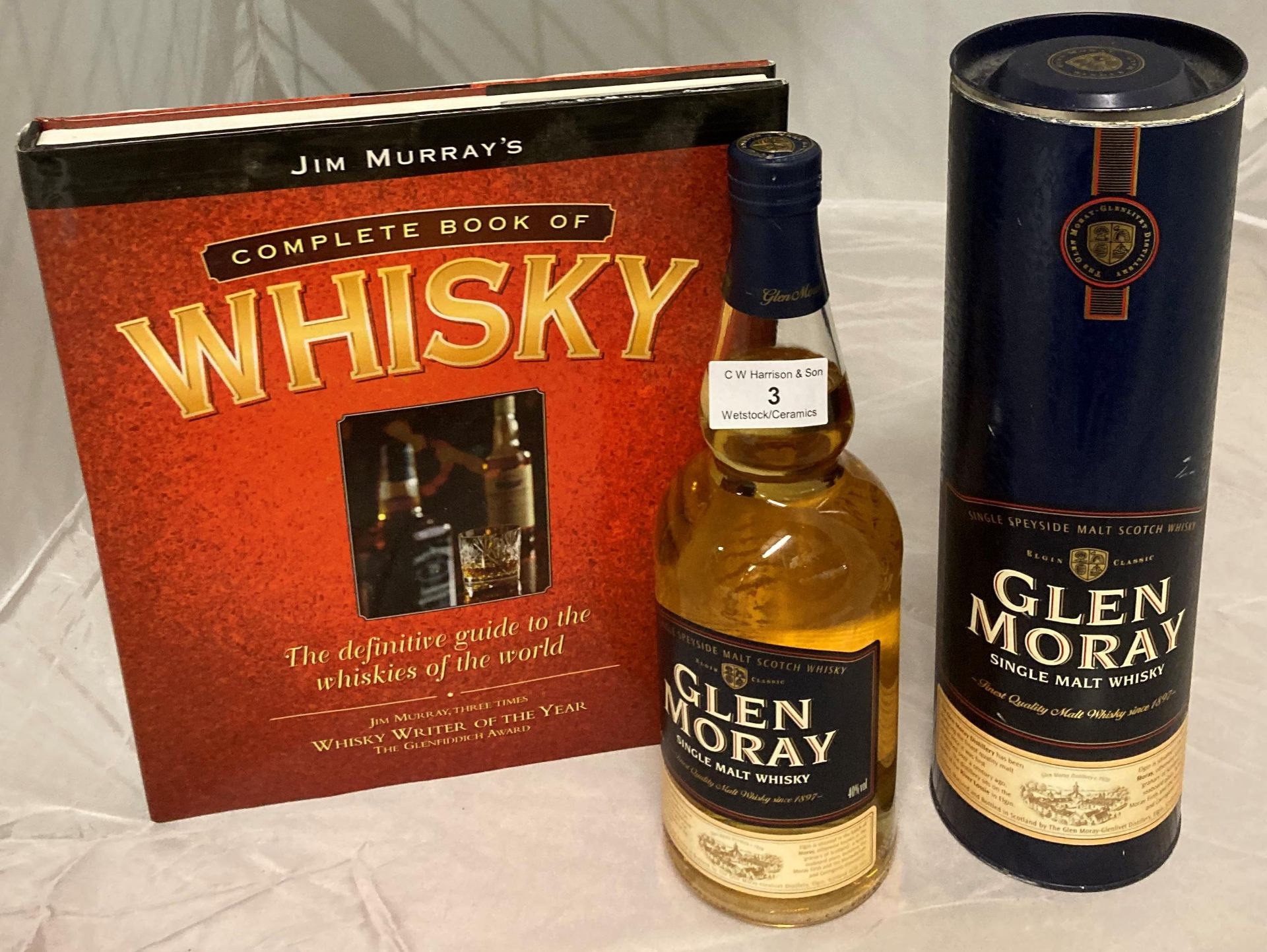 A 70cl bottle of Glen Moray Single Malt Whisky 40% volume in presentation canister and Jim Murray's - Image 2 of 2