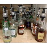 Fourteen part bottles of spirits and liqueurs (all with fitted measures - ten half full and four