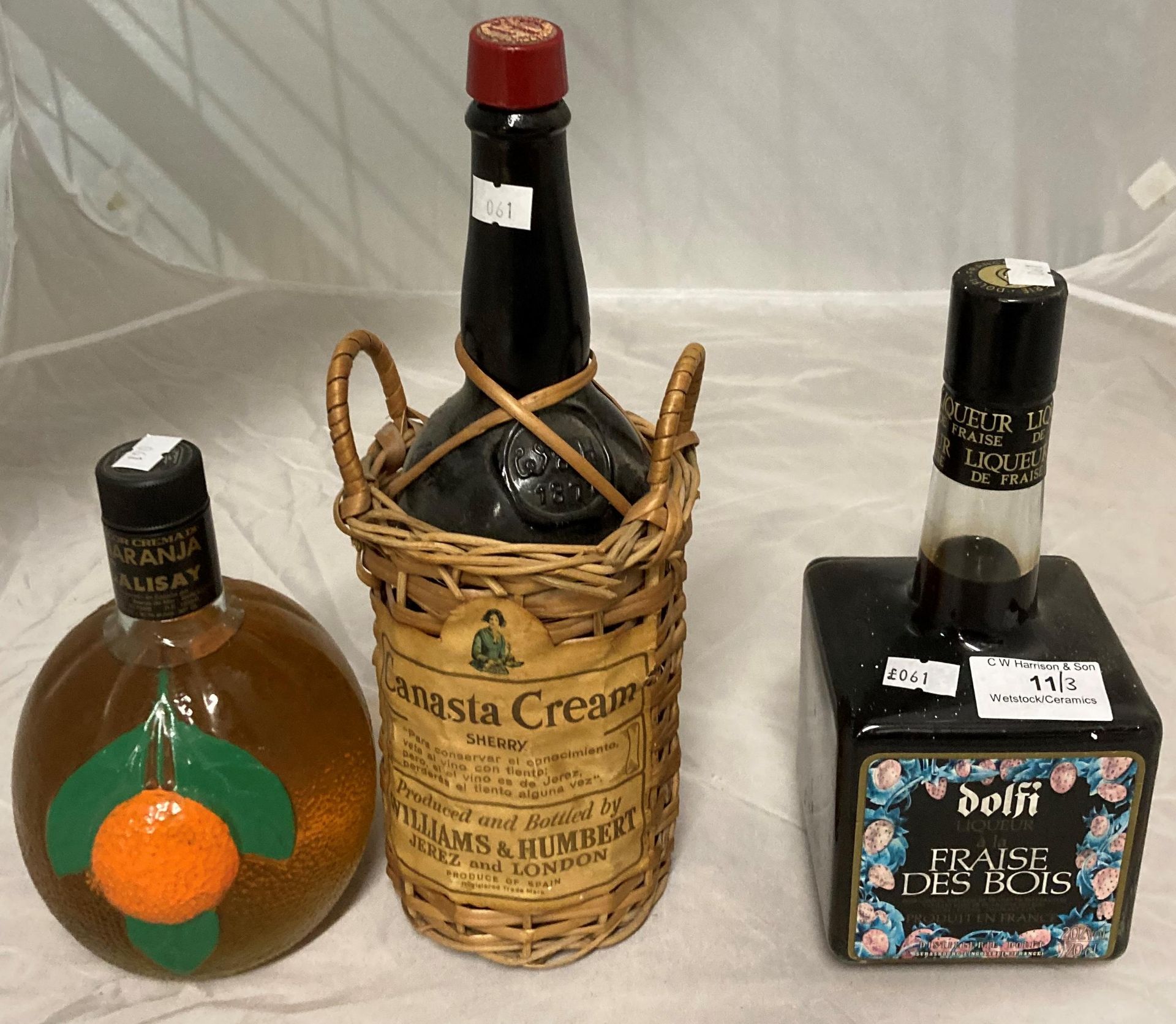 Three items - a 70cl bottle of Dolfi liqueur a la Fraise des Bois,
