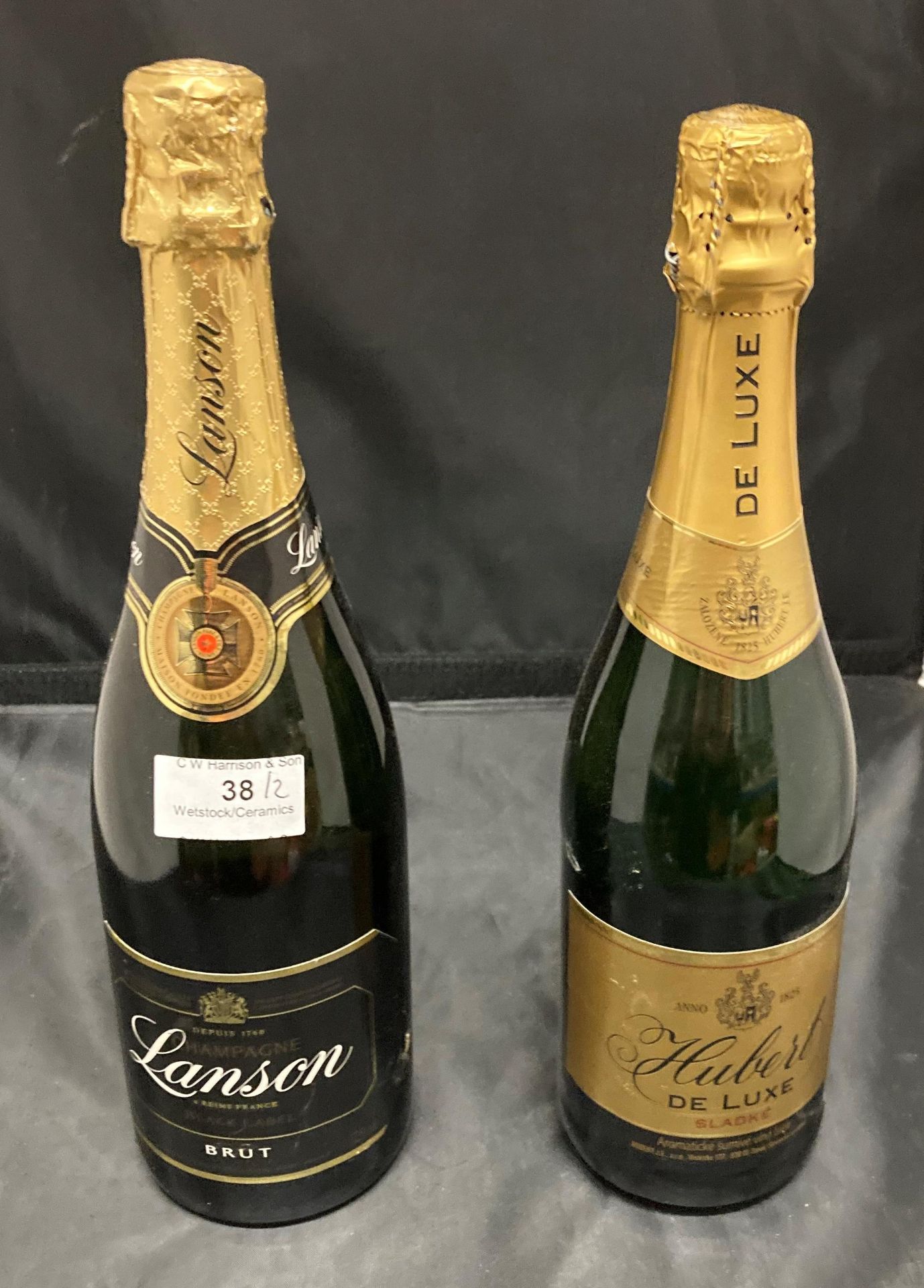 A 750ml bottle of Lanson Brut Champagne and a 75cl bottle of Hubert de Luxe sparkling wine