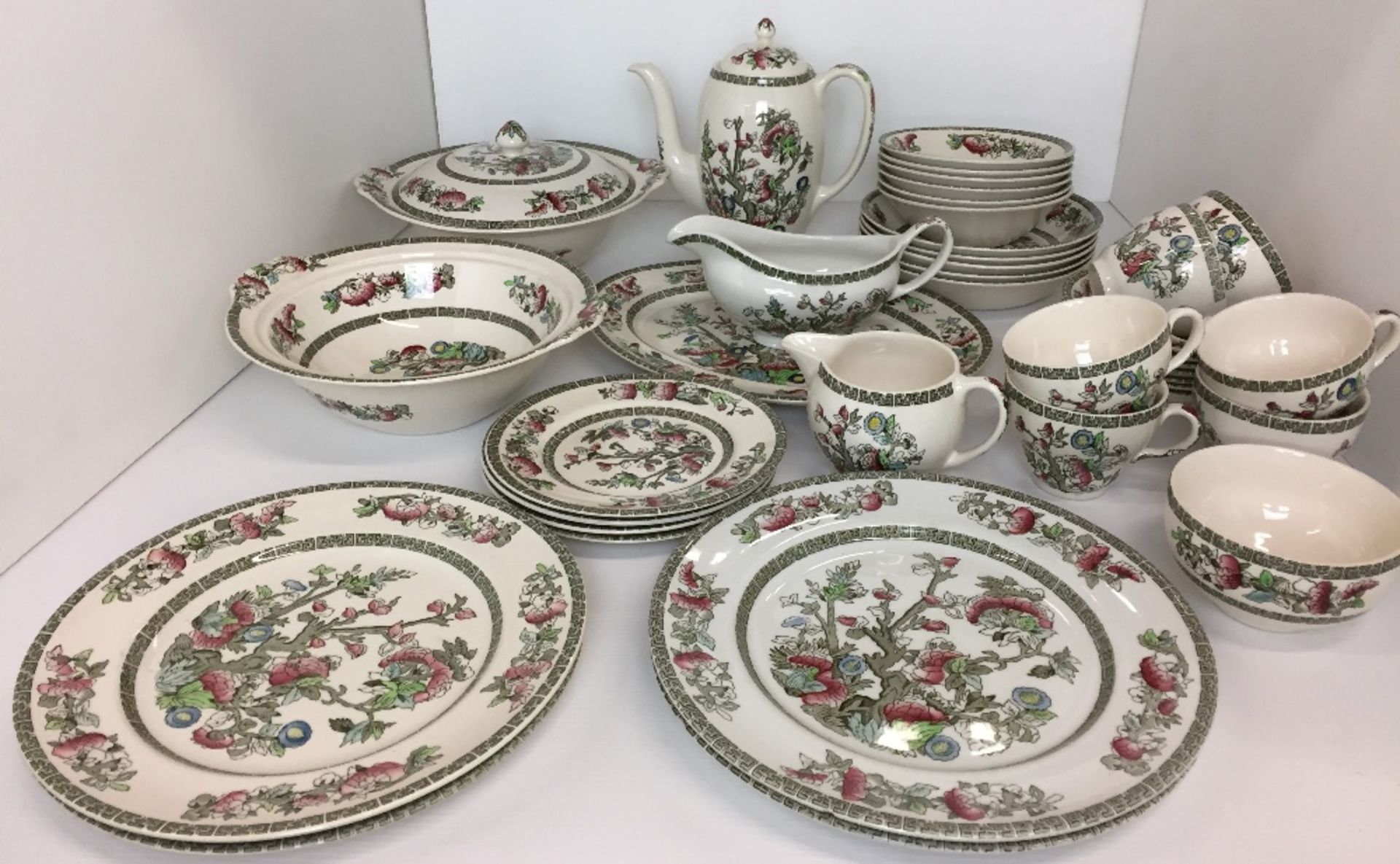 Thirty eight pieces of Johnson Bros Ironstone Indian Tree pattern dinner/tea service including four
