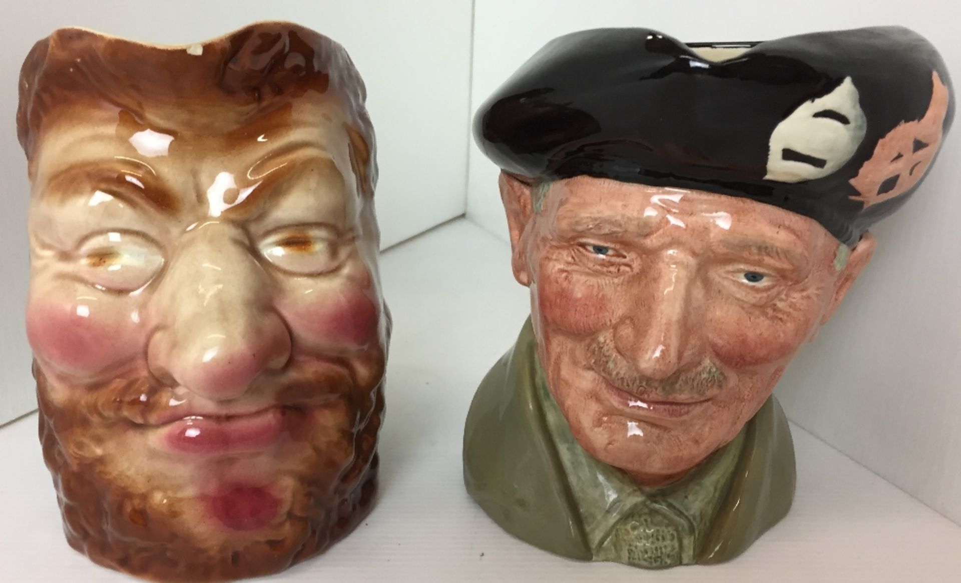 Two character jugs - Royal Doulton Monty 16cm high and Sarrfguemines red bearded man 15cm high