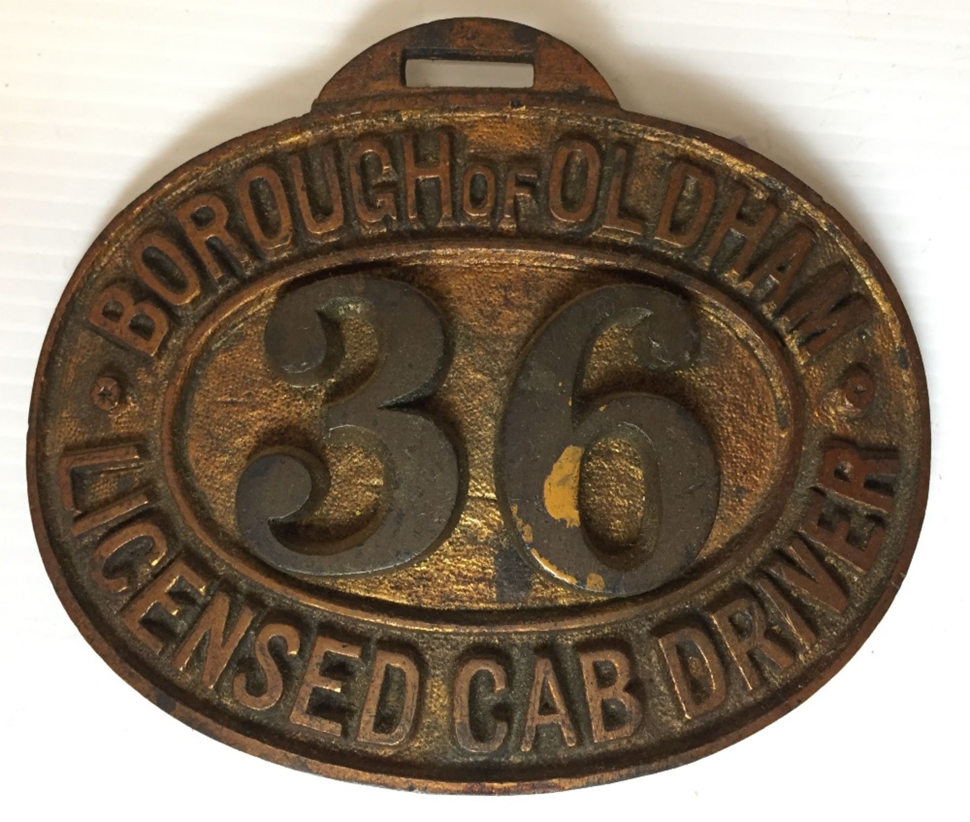 Brass badge "Burrough of Oldham Licensed Cab Driver 36" 11 x 9cm (saleroom location V13)