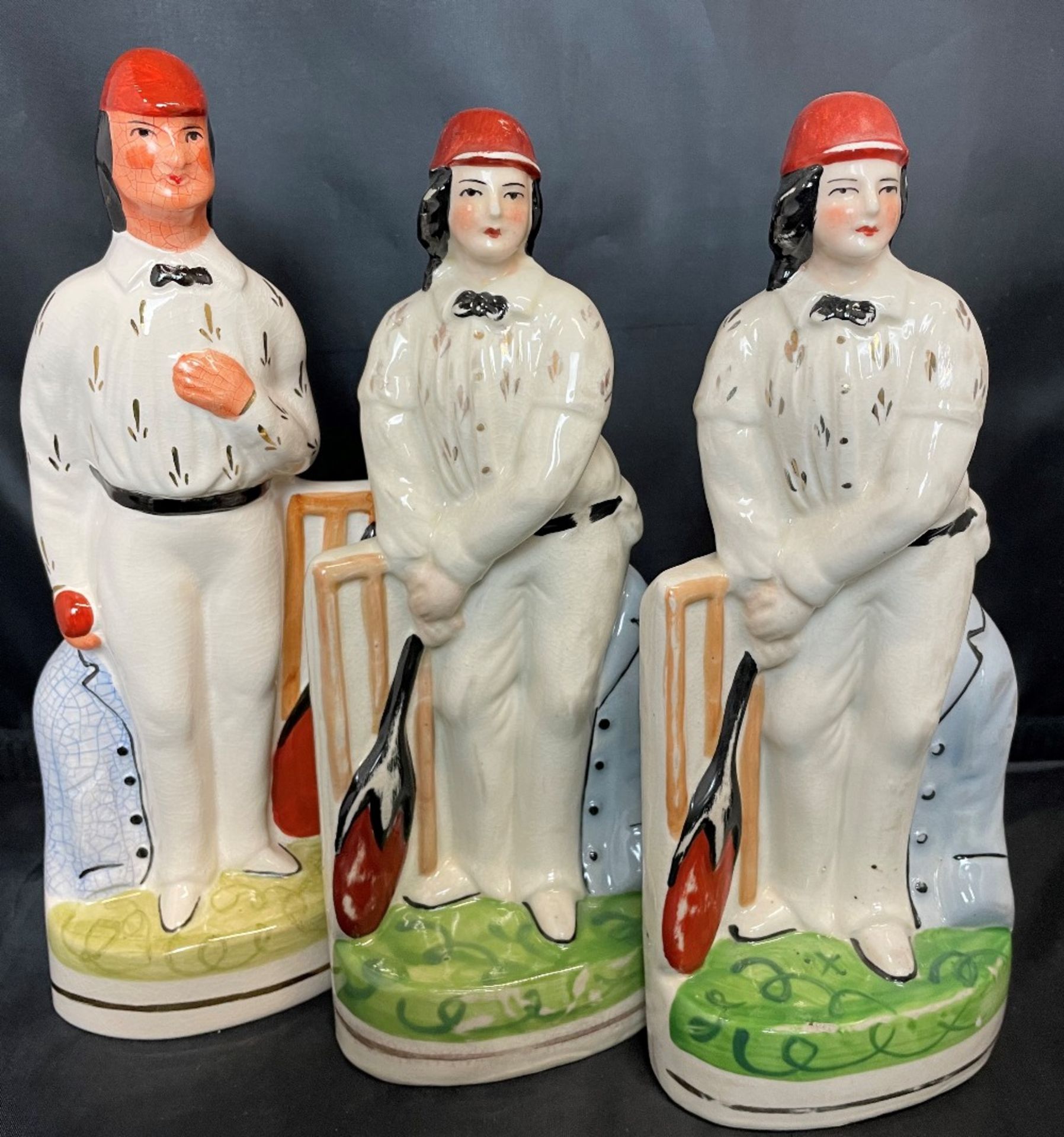 Three reproduction Staffordshire style cricketers 25cm high (saleroom location Z07)