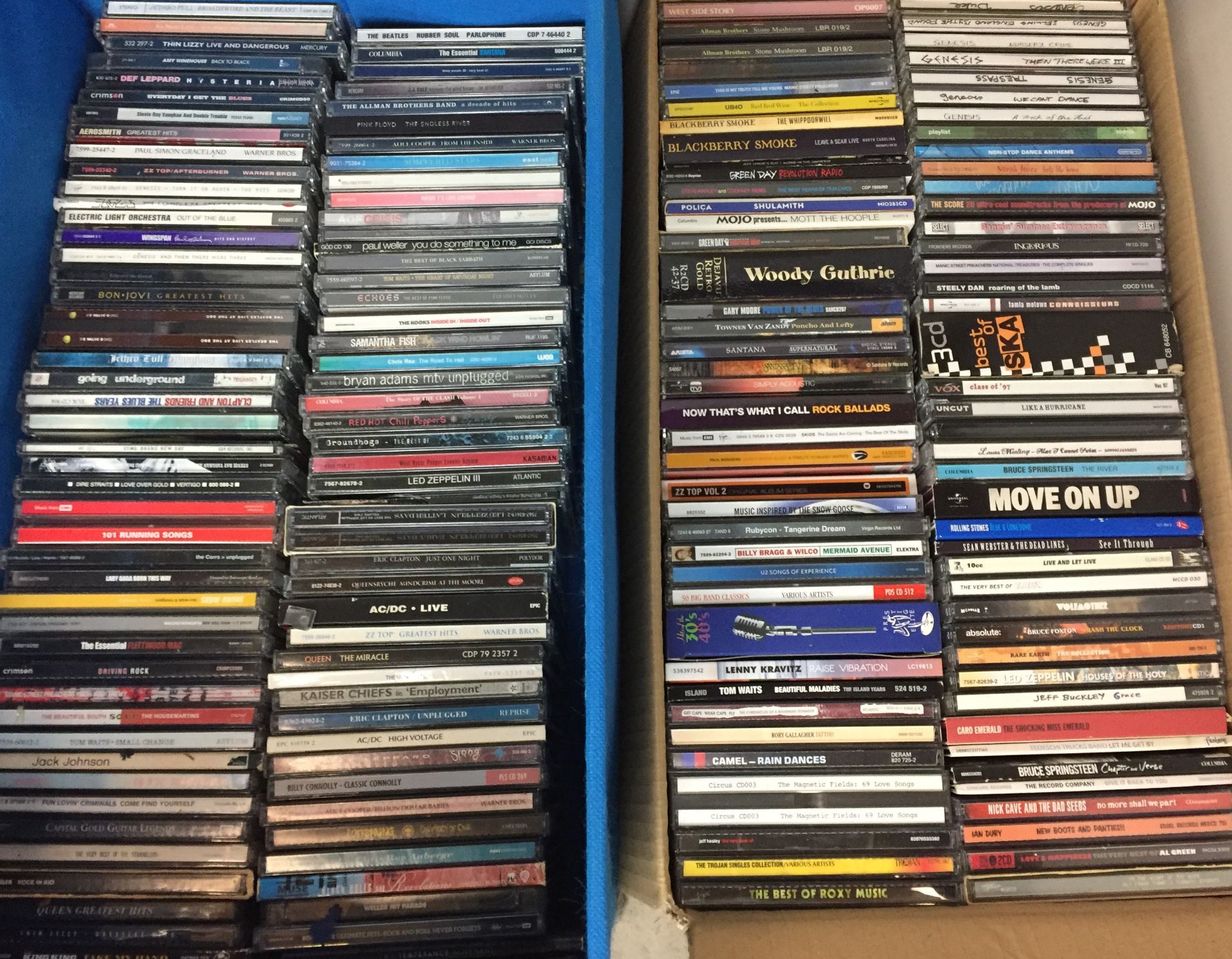 Two boxes containing one hundred and fifty plus CDs including AC/DC, Thin Lizzy, Rolling Stones,