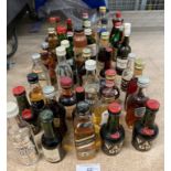 A collection of over forty full and part bottles of miniature spirits and liqueurs (Saleroom