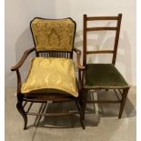 A mahogany stained beech open elbow chair with padded seat and spindle back and a small bedroom