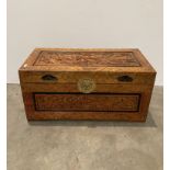 Wooden carved oriental style storage chest with brass clasps,
