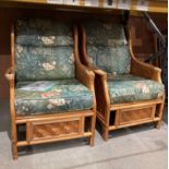A pair of bamboo conservatory high back armchairs with floral pattern pads (saleroom location: MW)