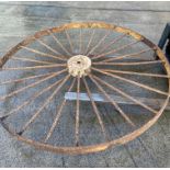 A large cast metal 24 spoke wheel,